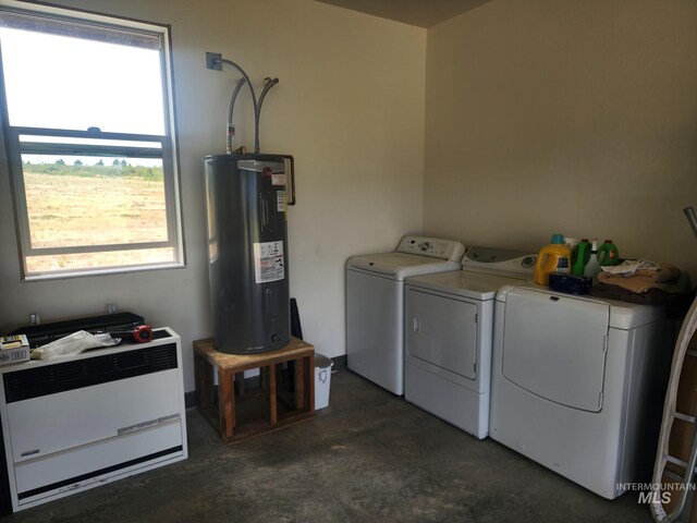 laundry room featuring separate washer and dryer and water heater