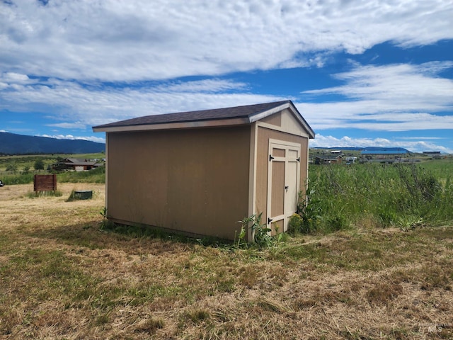 view of shed with a mountain view