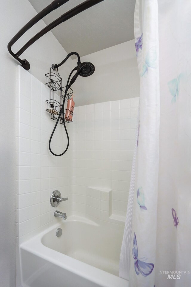 bathroom with shower / bath combination with curtain