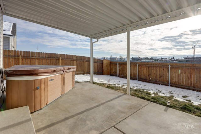 view of patio with a hot tub