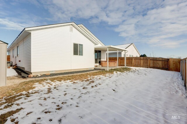 view of snow covered house