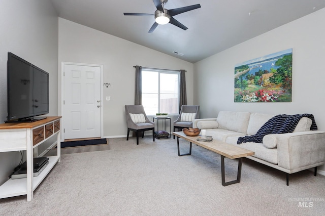 living room featuring lofted ceiling, ceiling fan, and carpet