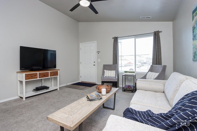 carpeted living room with lofted ceiling and ceiling fan