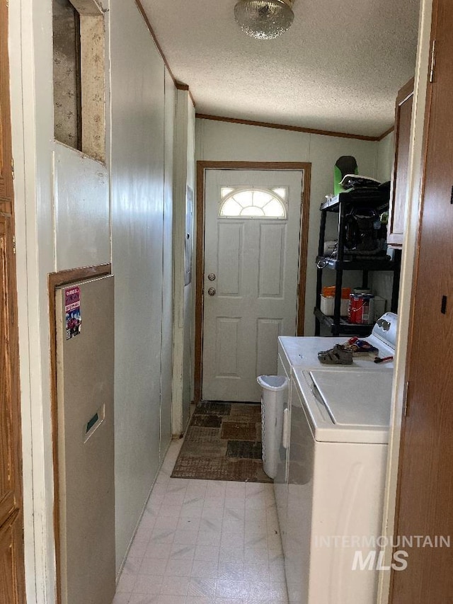 776 16th St, Vale, OR 97918 - laundry area with washing machine and dryer, light floors, and crown molding