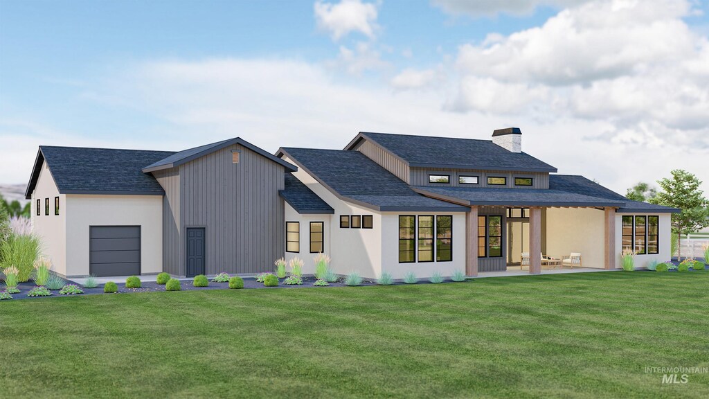 9334 Tula Dr, Middleton, ID 83644 - rear view of house with a garage, a chimney, and a lawn