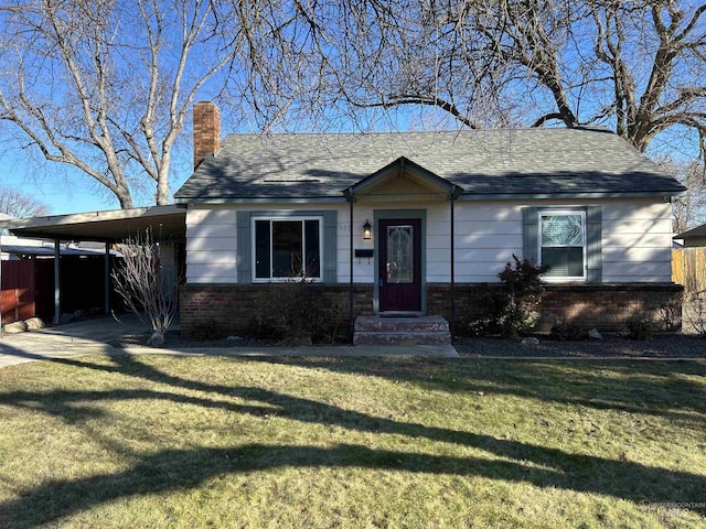 view of front of home featuring a front lawn and a carport