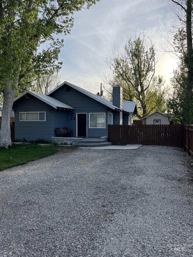 640 Roosevelt Ave, Grand View, ID 83624 - view of front of house with fence and a chimney