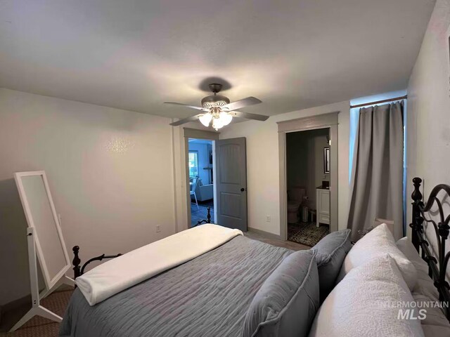 640 Roosevelt Ave, Grand View, ID 83624 - carpeted bedroom with connected bathroom, baseboards, and a ceiling fan