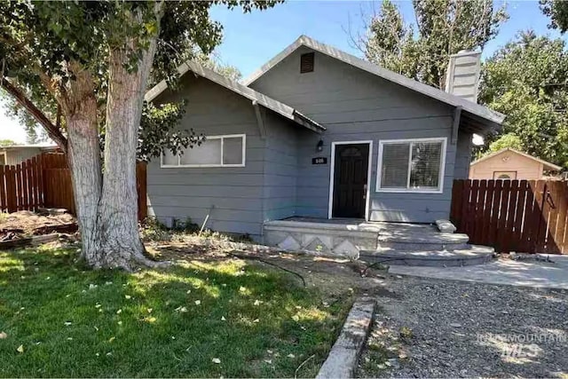 640 Roosevelt Ave, Grand View, ID 83624 - view of front of house featuring a chimney and fence