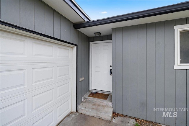 property entrance featuring an attached garage