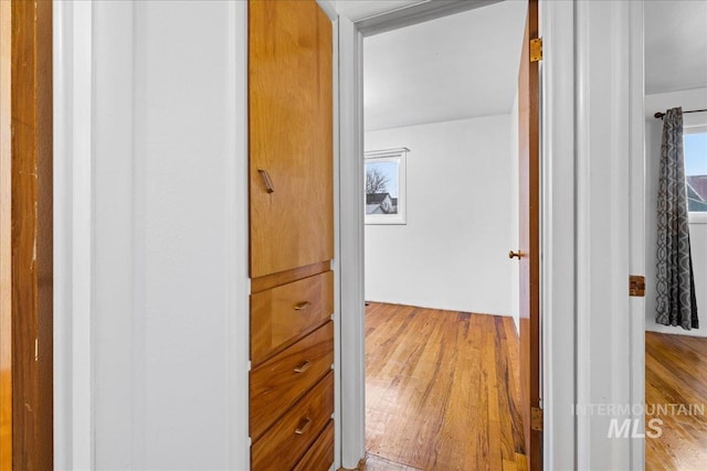 corridor with light wood-style floors