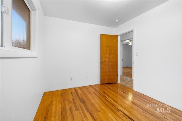 unfurnished room featuring wood finished floors