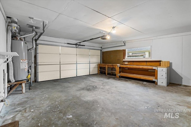 garage featuring gas water heater and a garage door opener