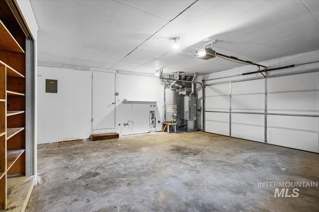 garage featuring electric panel, gas water heater, and a garage door opener