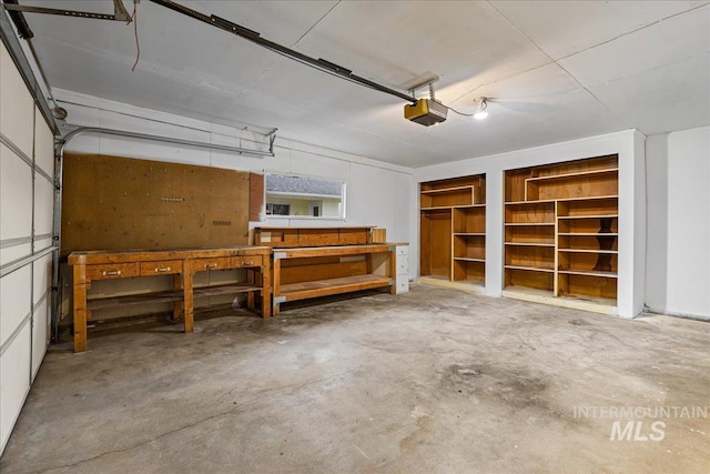 garage featuring a workshop area and a garage door opener