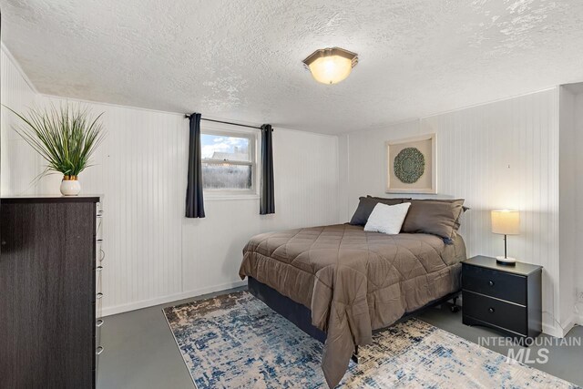 92 N Yale St, Nampa, ID 83651 - bedroom featuring a textured ceiling, finished concrete floors, and baseboards