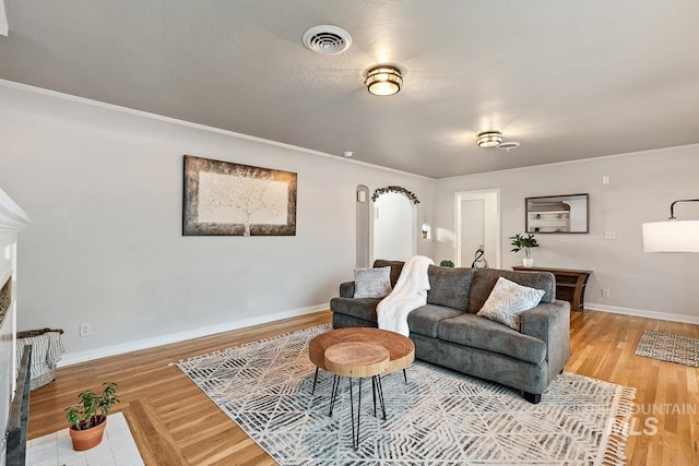 92 N Yale St, Nampa, ID 83651 - living room featuring crown molding, visible vents, wood finished floors, and baseboards