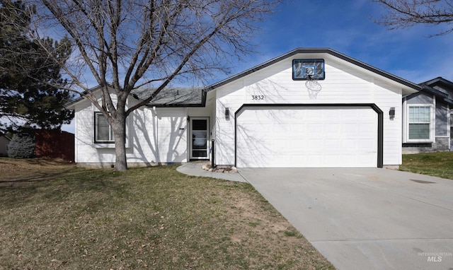 ranch-style house featuring driveway, a front lawn, and an attached garage