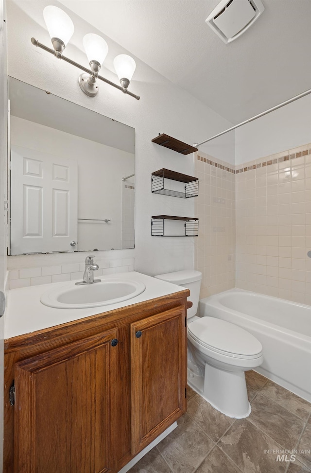 full bath featuring vanity, toilet, visible vents, and shower / bath combination