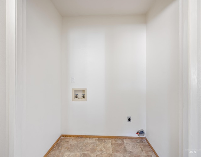 washroom with baseboards, hookup for an electric dryer, hookup for a washing machine, and laundry area