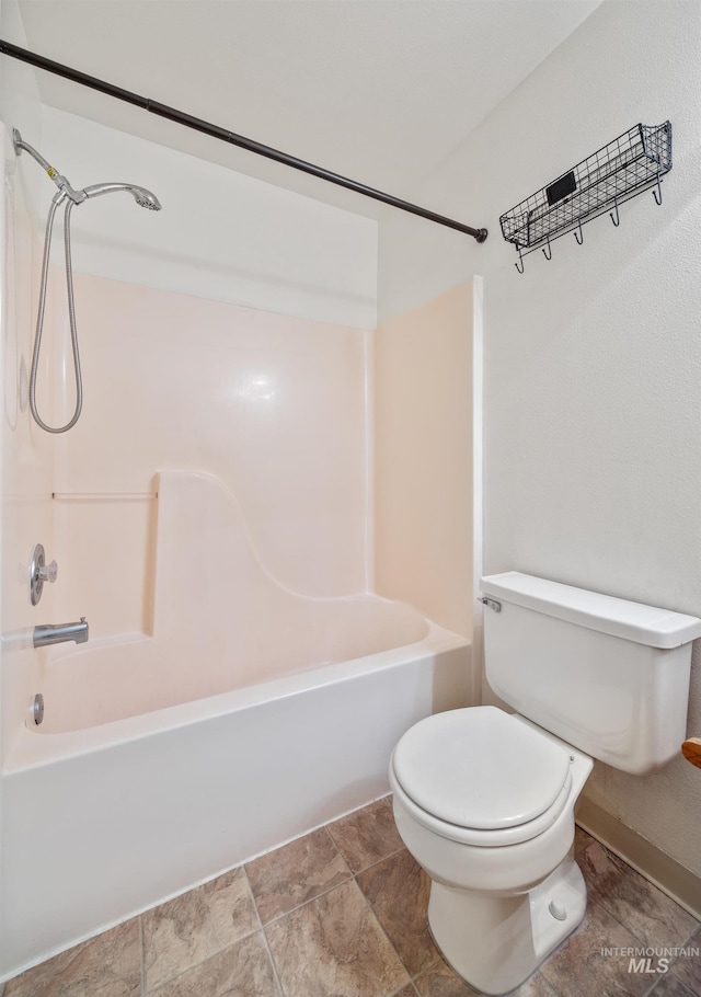 bathroom with toilet and shower / tub combination