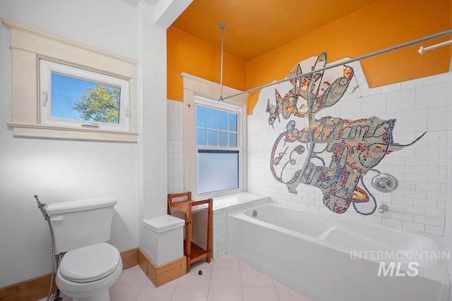 full bath with toilet, a bath, tile patterned flooring, and baseboards