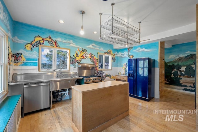 kitchen featuring stainless steel counters, recessed lighting, black fridge with ice dispenser, light wood-style floors, and stainless steel dishwasher