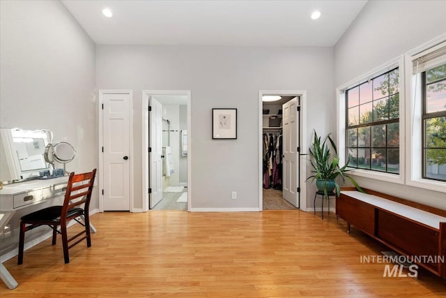 office space featuring light wood-style floors, recessed lighting, and baseboards