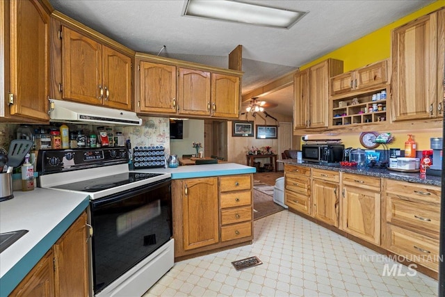 kitchen with kitchen peninsula, ceiling fan, a textured ceiling, and white electric stove