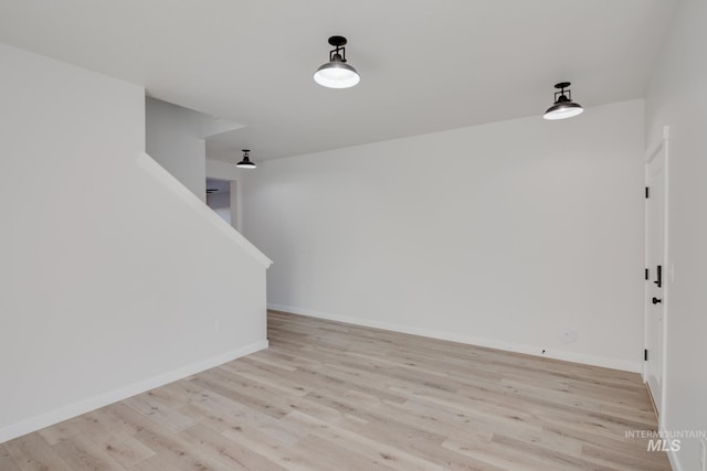 empty room with light hardwood / wood-style floors