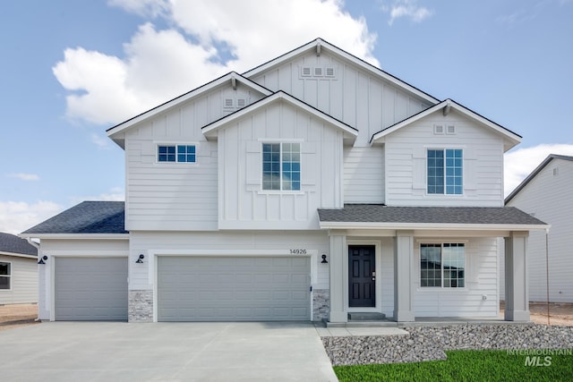 view of front of property with a porch and a garage