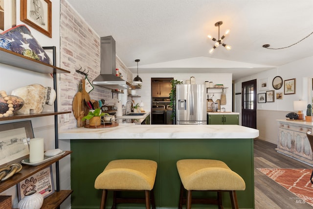 5950 Elmore Rd, New Plymouth, ID 83655 - kitchen with stainless steel fridge with ice dispenser, wall chimney exhaust hood, a peninsula, a sink, and dark wood-style flooring