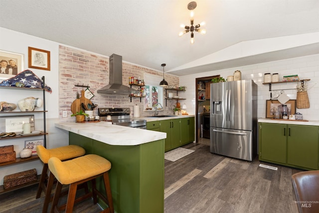 5950 Elmore Rd, New Plymouth, ID 83655 - kitchen with green cabinetry, stainless steel appliances, wall chimney range hood, a sink, and open shelves