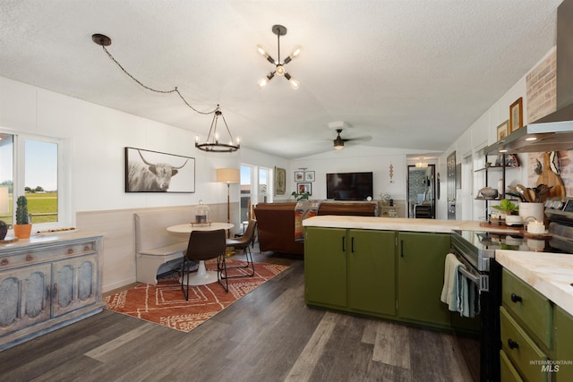 5950 Elmore Rd, New Plymouth, ID 83655 - kitchen with green cabinets, electric range, a chandelier, a peninsula, and lofted ceiling