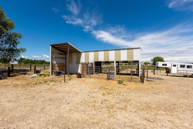 5950 Elmore Rd, New Plymouth, ID 83655 - view of outdoor structure featuring an exterior structure, a view of countryside, and a carport