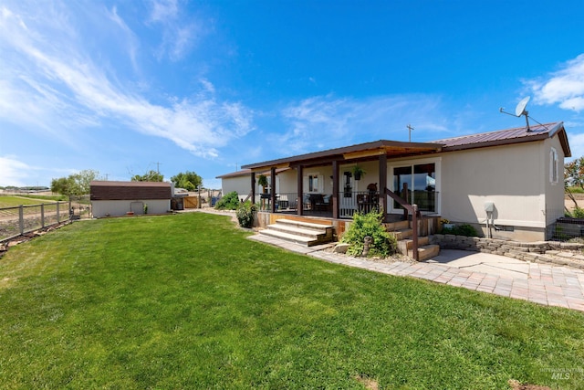 5950 Elmore Rd, New Plymouth, ID 83655 - back of house featuring a porch and metal roof