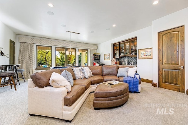 living area featuring recessed lighting, carpet flooring, and baseboards