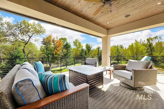 view of patio featuring ceiling fan, a balcony, and an outdoor hangout area