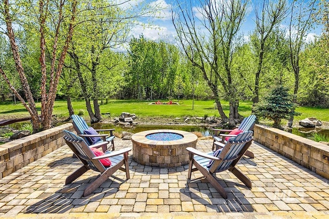 view of patio featuring an outdoor fire pit