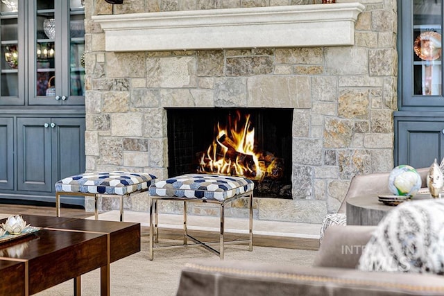 room details featuring a lit fireplace