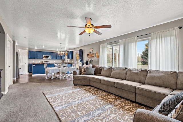 2801 W Lost Rpds, Meridian, ID 83646 - living area featuring a textured ceiling and ceiling fan with notable chandelier