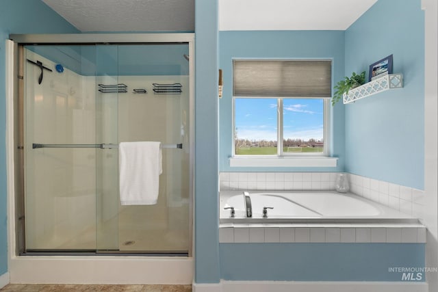 2801 W Lost Rpds, Meridian, ID 83646 - full bathroom featuring a bath, a shower stall, and a textured ceiling
