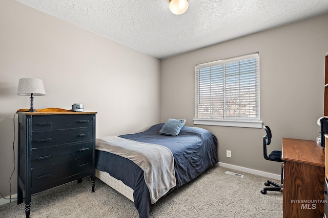 2801 W Lost Rpds, Meridian, ID 83646 - carpeted bedroom featuring visible vents, baseboards, and a textured ceiling