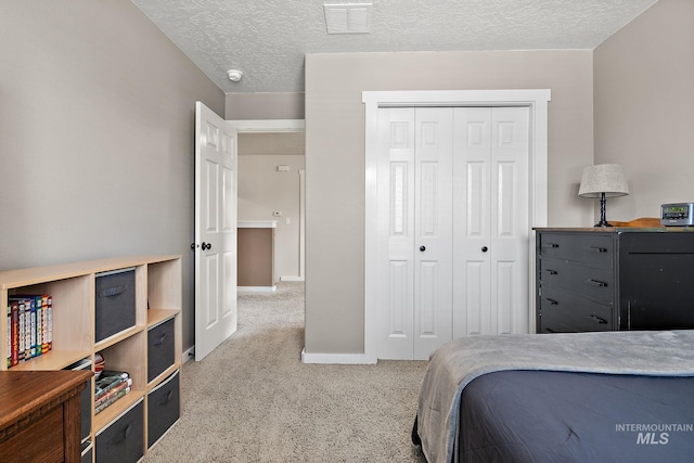 2801 W Lost Rpds, Meridian, ID 83646 - bedroom with carpet, a textured ceiling, a closet, visible vents, and baseboards