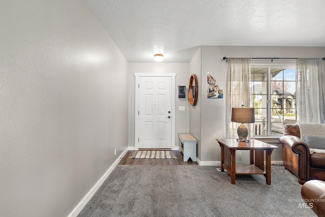 2801 W Lost Rpds, Meridian, ID 83646 - entryway with carpet flooring, baseboards, and a textured ceiling