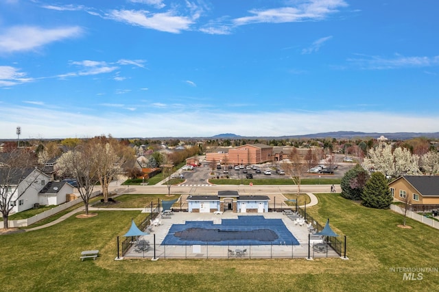 2801 W Lost Rpds, Meridian, ID 83646 - community pool with a residential view, a mountain view, a patio area, fence, and a lawn