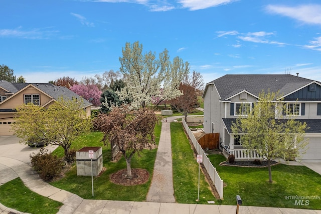 2801 W Lost Rpds, Meridian, ID 83646 - exterior space featuring a garage, a lawn, a porch, fence, and concrete driveway