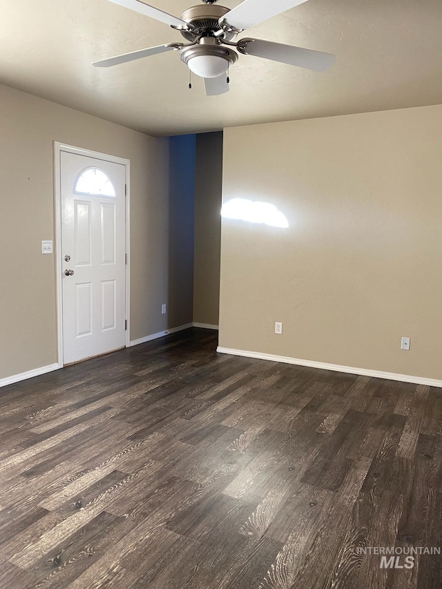 entrance foyer with baseboards and dark wood-style floors