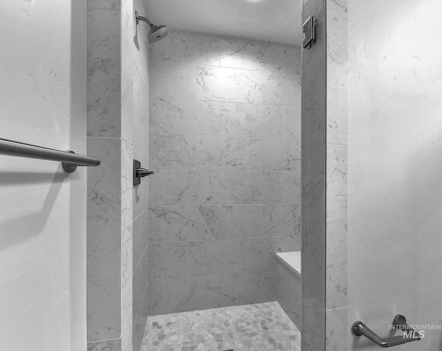 full bath featuring a shower stall