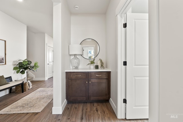 bar with wood finished floors and baseboards